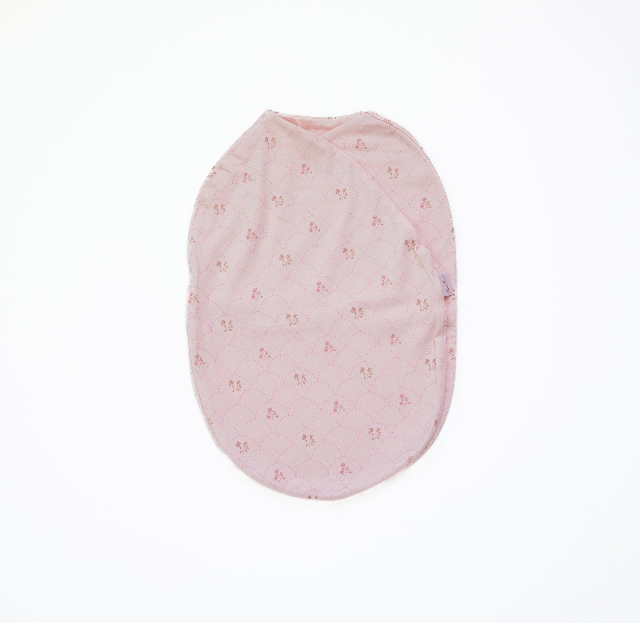 Baby swaddle cocoon blanket crafted from bamboo and organic cotton fabric, decorated with Dainty Dots.