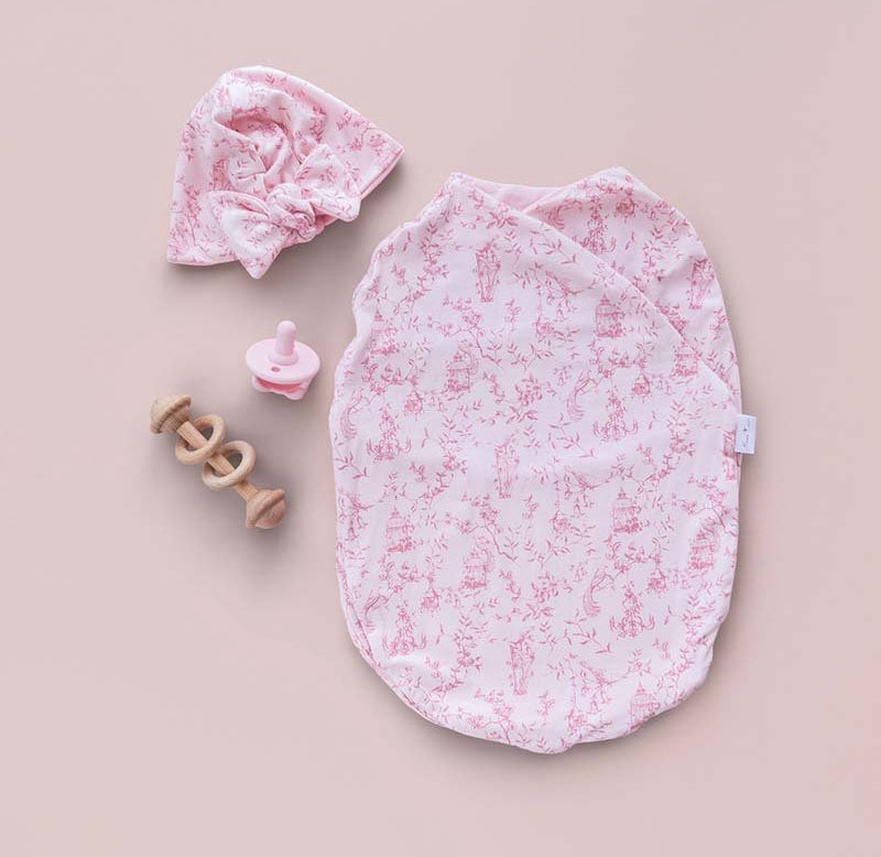 Soft and breathable baby cocoon swaddle blanket made from bamboo-organic cotton blend featuring Whimsical Garden design.