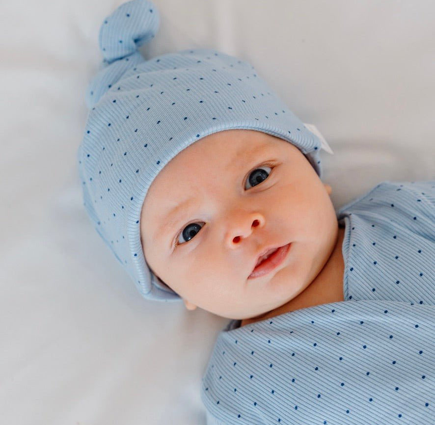 Dotted blues design baby beanie for short-sleeve onesie.