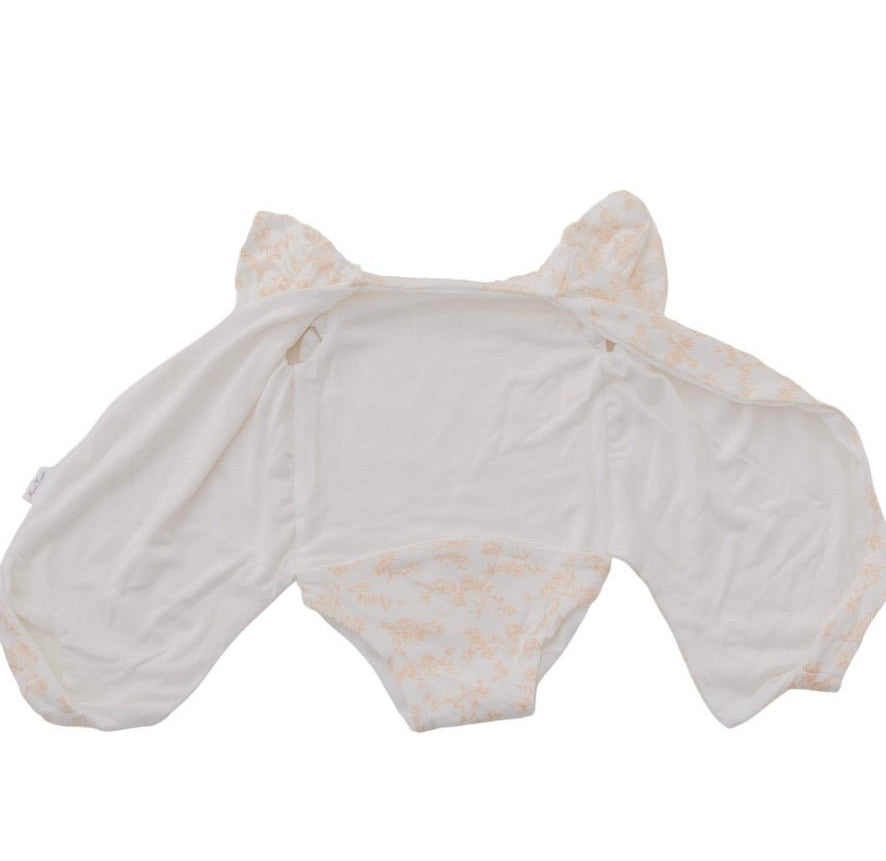 Reversible Bitty Blooms design flutter sleeve winged bodysuit in silky modal fabric.