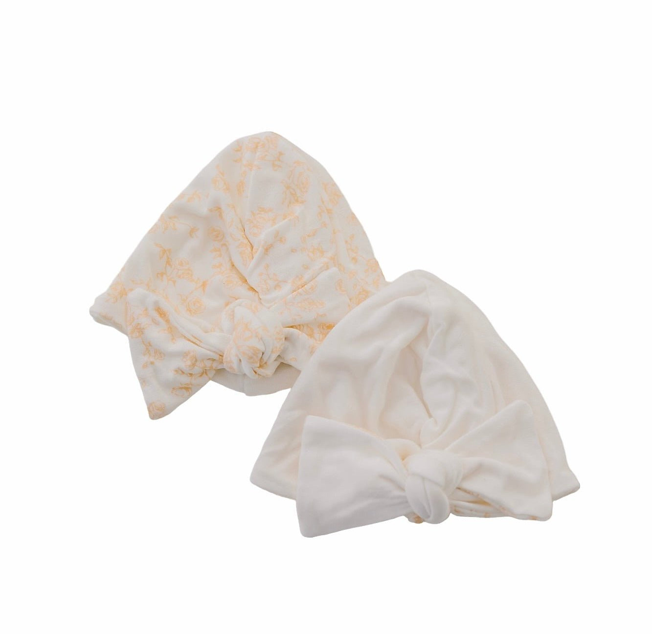 Ruched baby beanies with bows crafted in soft Bitty Blooms design Silky Modal fabric.