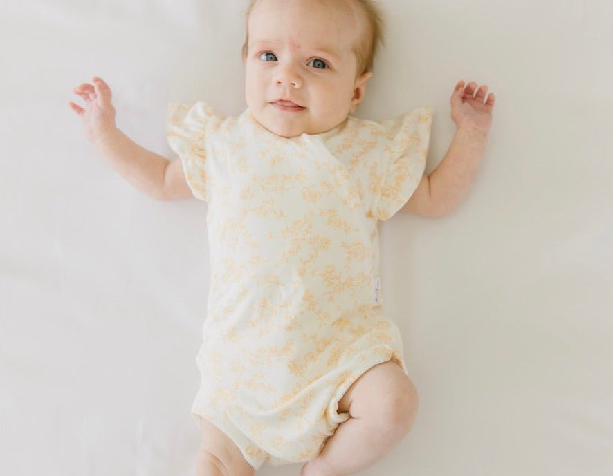 Bitty blooms design flutter sleeve baby onesie in silky modal fabric.