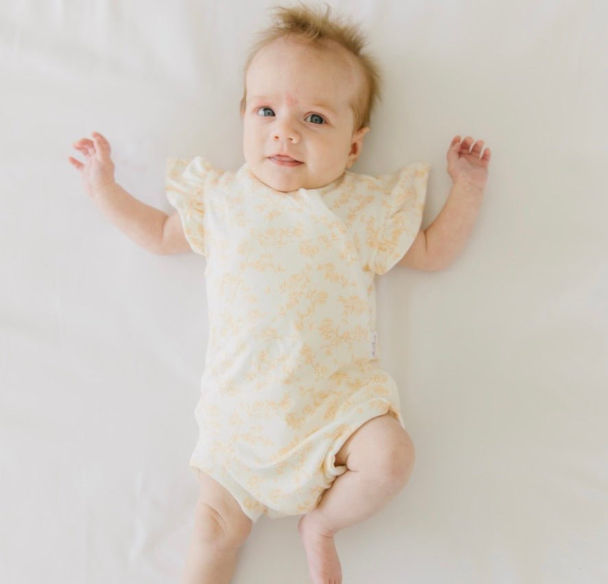 Bitty blooms design flutter sleeve baby onesie in silky modal fabric.
