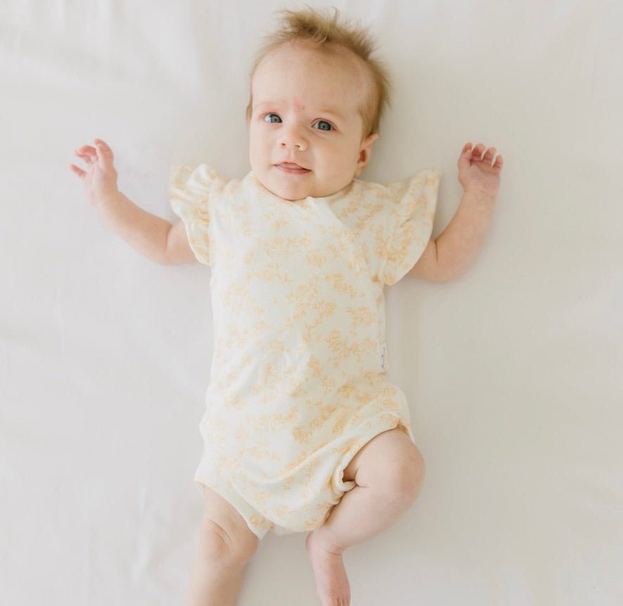Bitty blooms design flutter sleeve baby onesie in silky modal fabric.