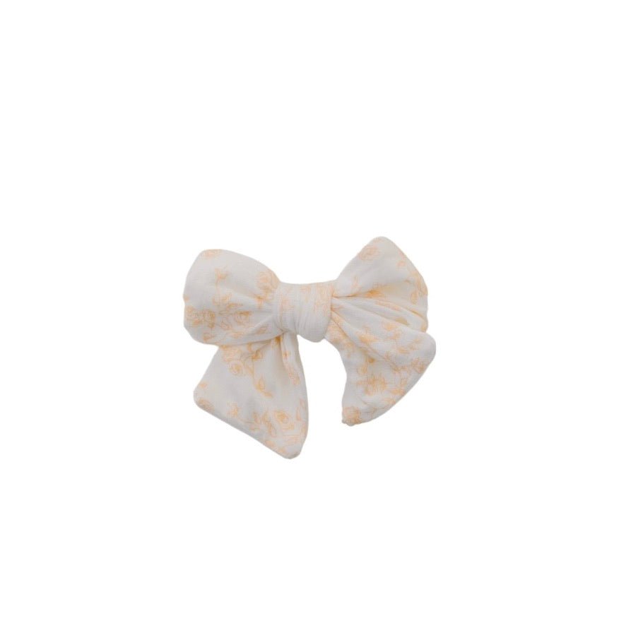 Bitty Blooms headband for babies, featuring a stylish bow detail.