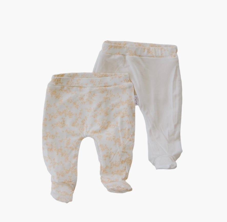 Reversible baby footie pants in bitty blooms design.
