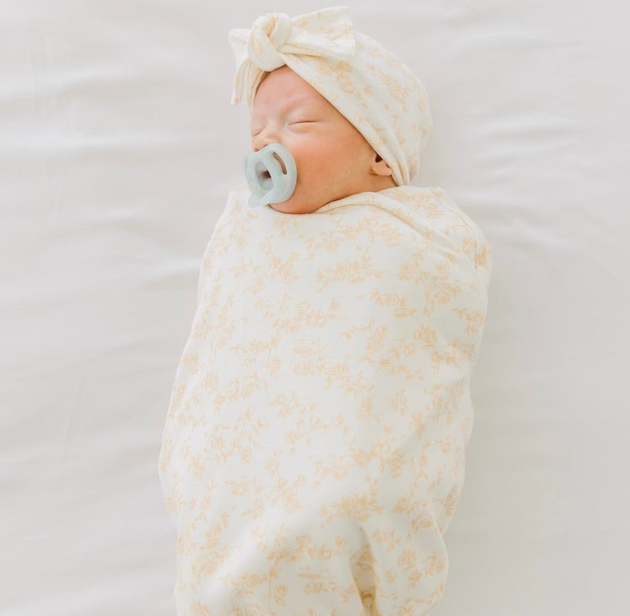 Silk modal newborn essentials bundle featuring a long sleeve top with ruffle cuffs, in bitty blooms design.