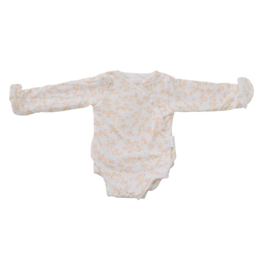 Bitty Blooms design ruffle cuff long sleeve winged bodysuit in silky modal fabric.