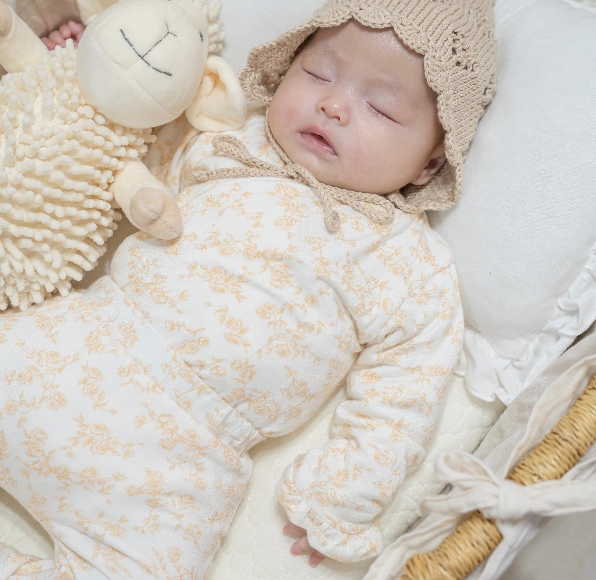 Baby ruffle cuff winged bodysuit made from silky modal fabric in Bitty Blooms design.