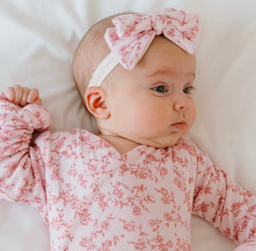 Flutter sleeve baby onesie outfit bundle made from silky modal fabric in bitty pink blooms design.