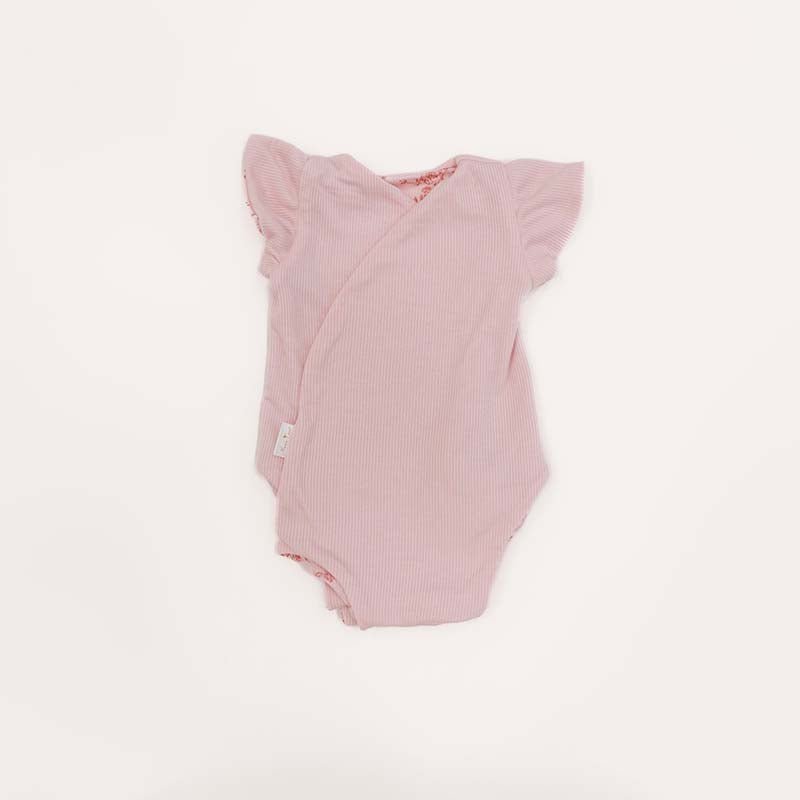 Reversible Bitty Pink Blooms design flutter sleeve winged bodysuit in silky modal fabric.