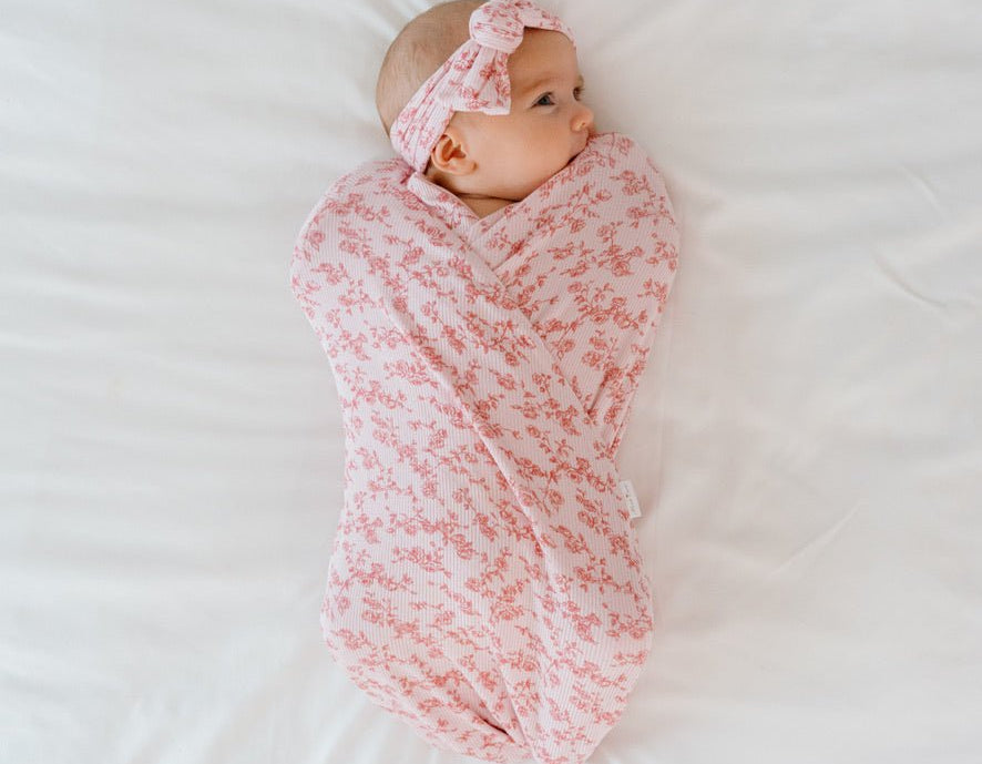 Bitty pink blooms design baby onesie outfit in silky modal fabric.
