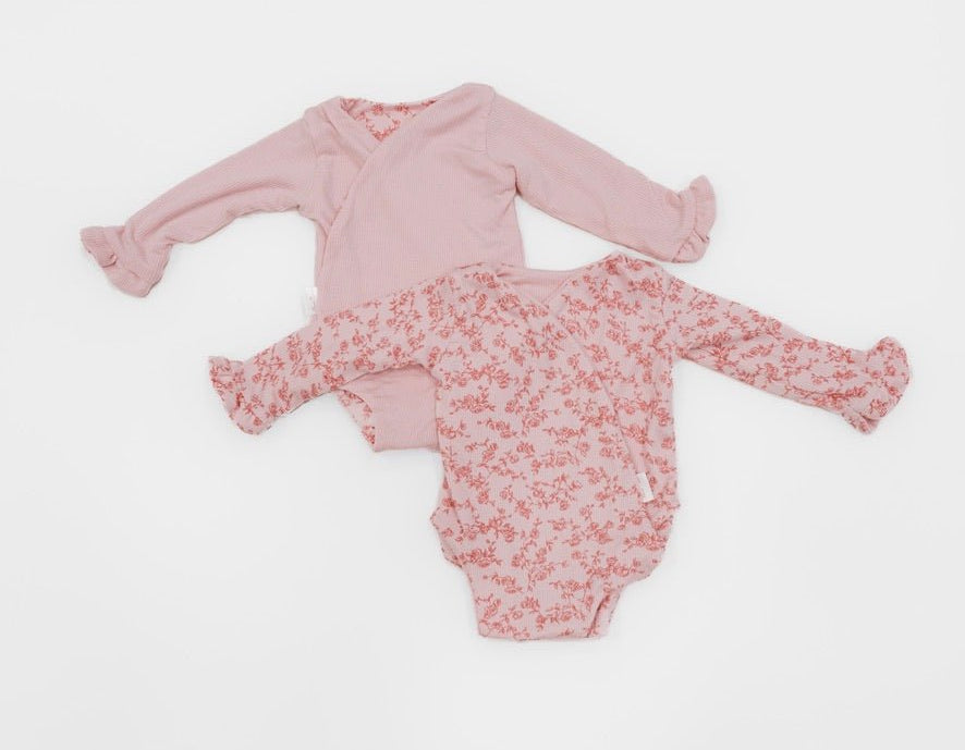 Reversible bitty pink blooms design baby onesie outfit in silky modal fabric.