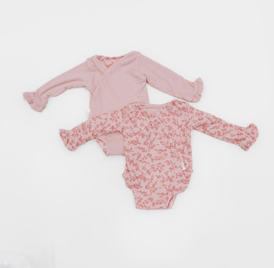 Reversible bitty pink blooms design baby onesie outfit in silky modal fabric.