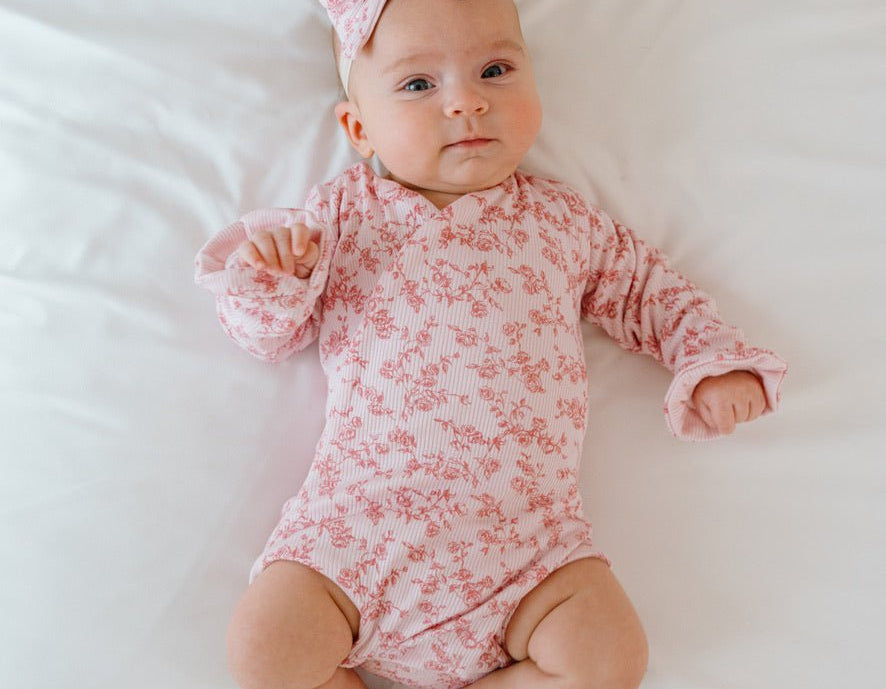 Bitty pink blooms design baby onesie outfit in silky modal fabric.