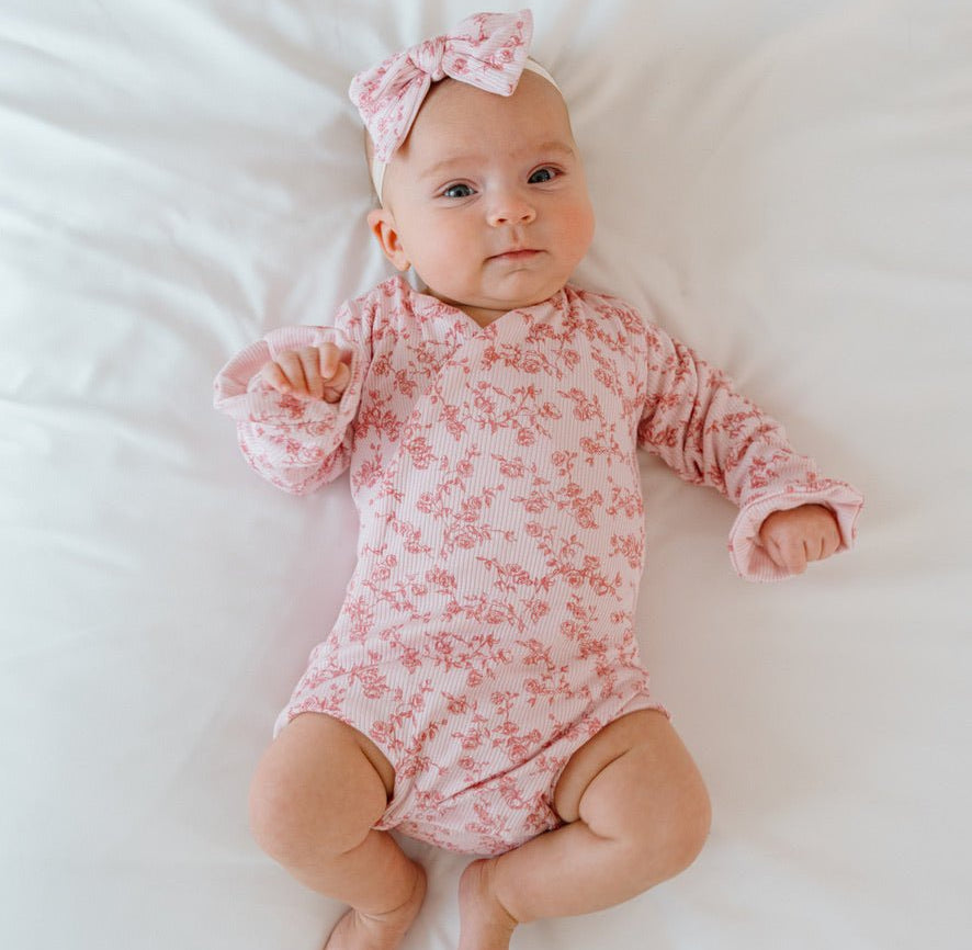Bitty pink blooms design baby onesie outfit in silky modal fabric.