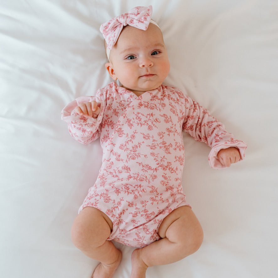 Bitty pink blooms design baby onesie outfit in silky modal fabric.