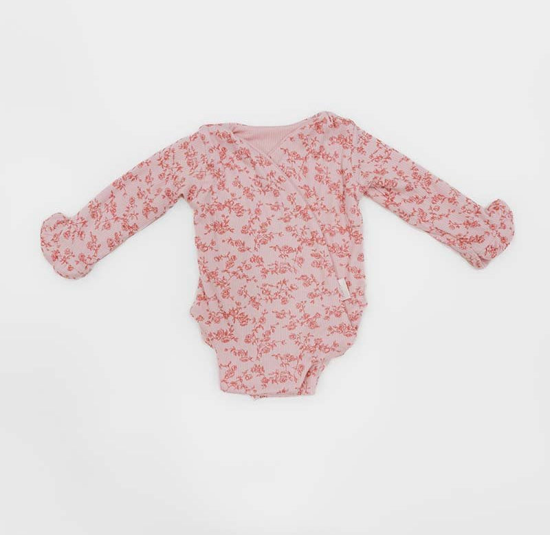 Bitty Pink Blooms design ruffle cuff long sleeve winged bodysuit in silky modal fabric.