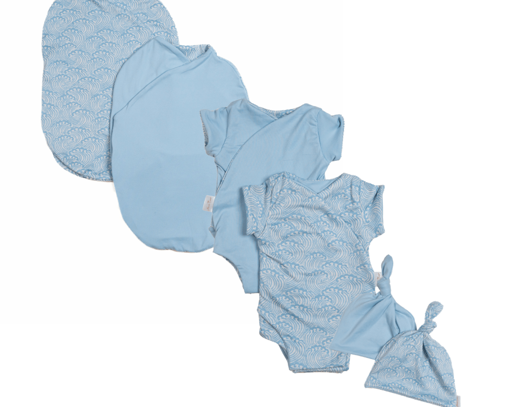 Newborn essentials bundle with short sleeves in classic brushed fabric with blue swells design.