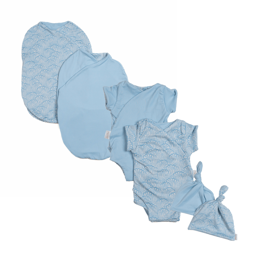 Newborn essentials bundle with short sleeves in classic brushed fabric with blue swells design.