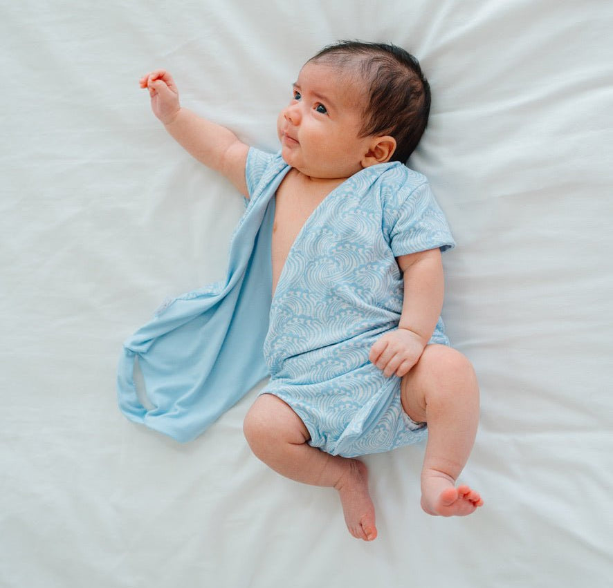 Stylish classic brushed short-sleeve winged bodysuit with the soft Blue Swells design.