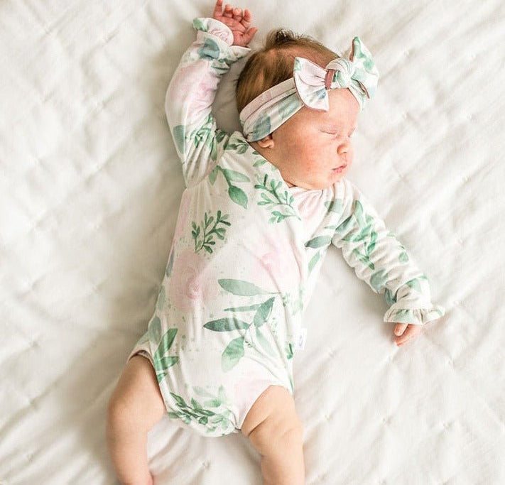 Soft Blushing Eucalyptus design brushed fabric baby bodysuit with winged sleeves and elegant ruffle cuffs.