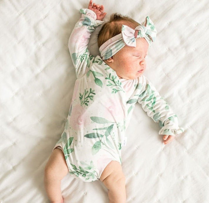 Soft Blushing Eucalyptus design brushed fabric baby bodysuit with winged sleeves and elegant ruffle cuffs.