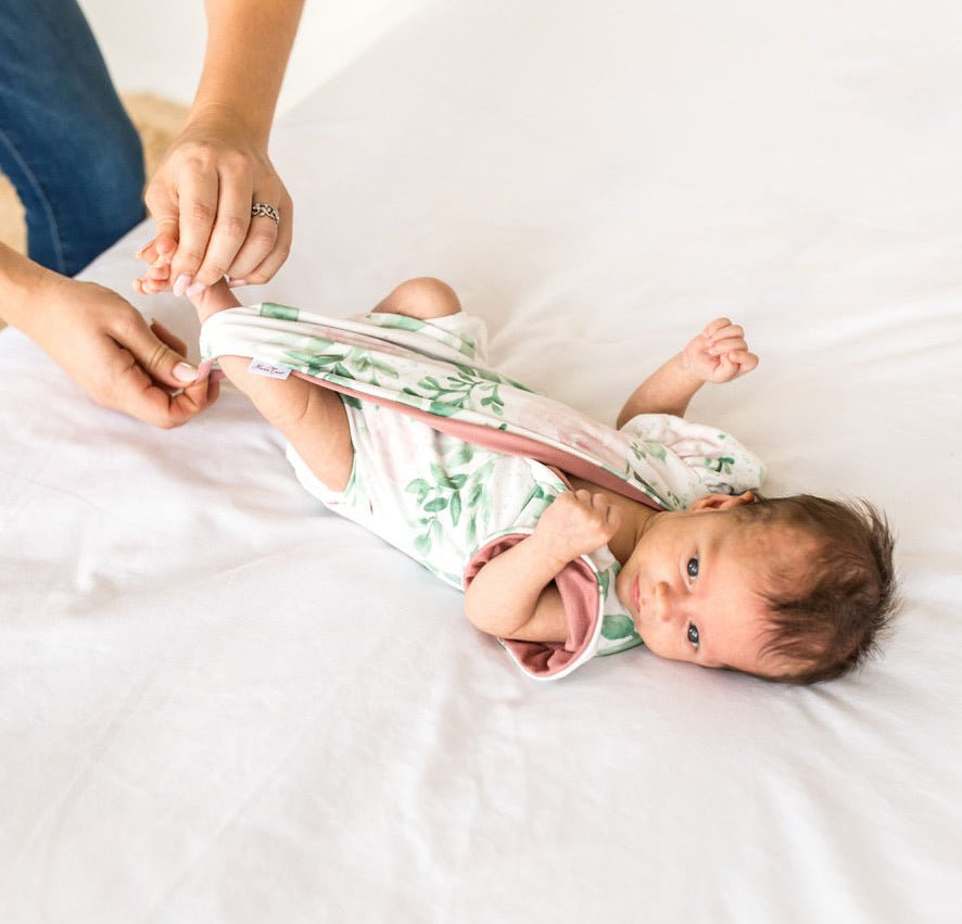 Short-sleeve bodysuit for baby in Classic Brushed fabric styles featuring the Blushing Eucalyptus print.
