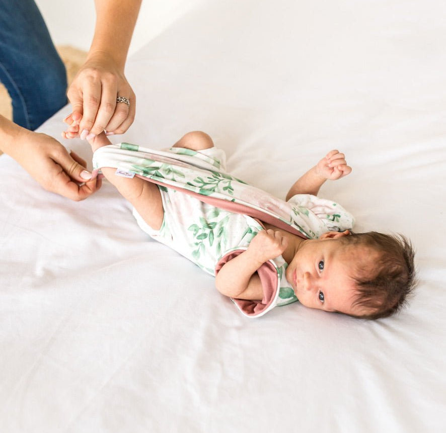 Short-sleeve bodysuit for baby in Classic Brushed fabric styles featuring the Blushing Eucalyptus print.