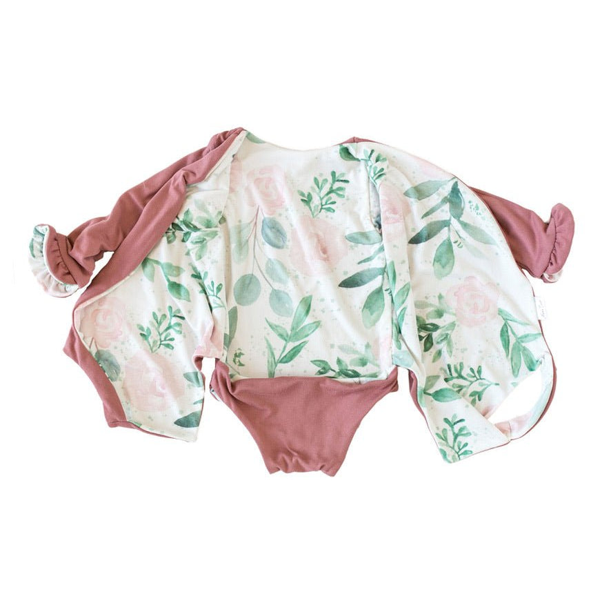 Comfortable Blushing Eucalyptus design brushed fabric baby bodysuit with wings and ruffle trim cuffs.