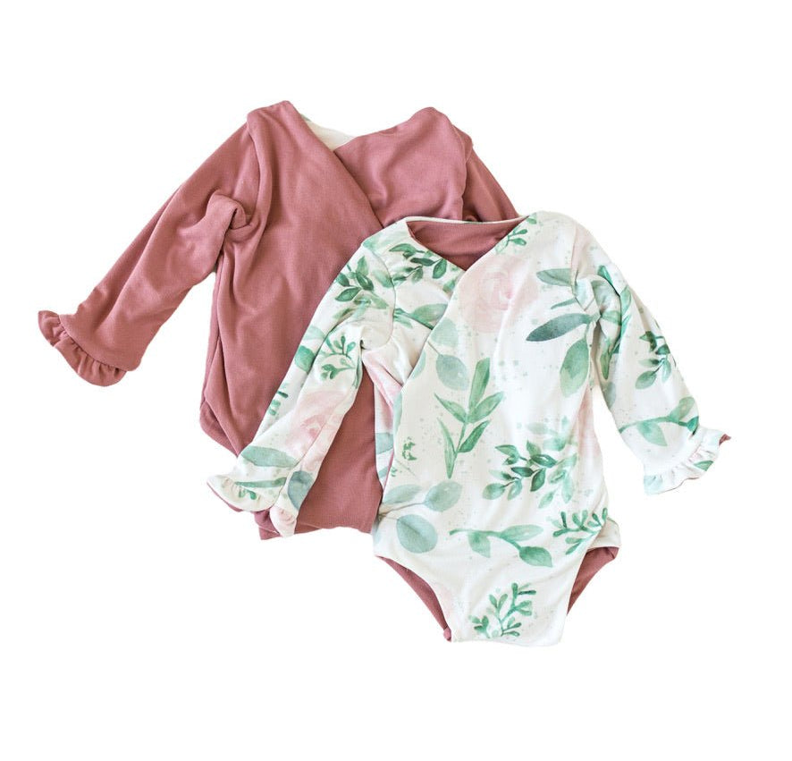 Long-sleeved winged baby bodysuit featuring ruffle cuffs in soft Blushing Eucalyptus design brushed fabric.