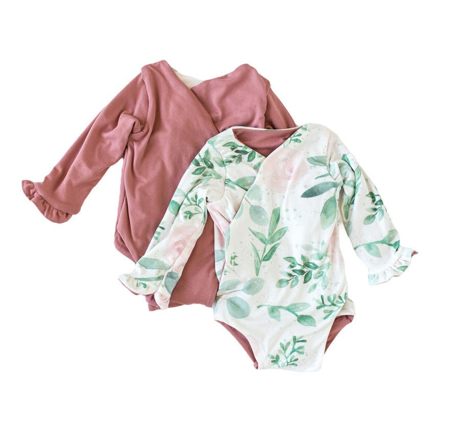 Long-sleeved winged baby bodysuit featuring ruffle cuffs in soft Blushing Eucalyptus design brushed fabric.