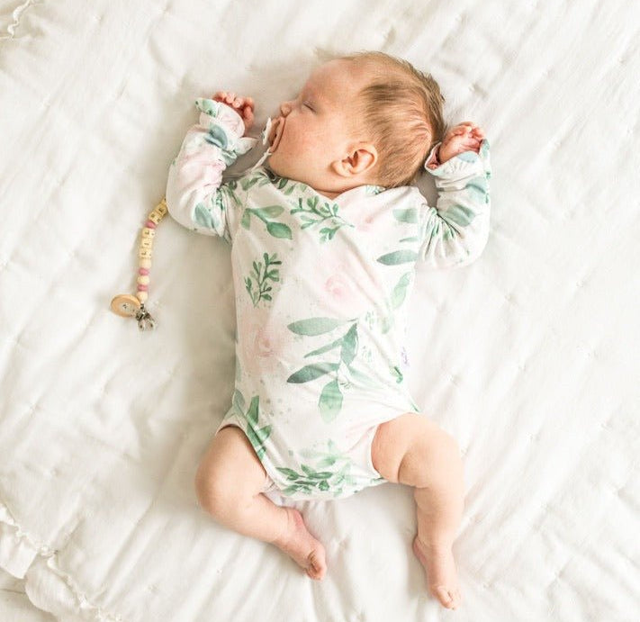 Long-sleeved winged baby bodysuit featuring ruffle cuffs in soft Blushing Eucalyptus design brushed fabric.