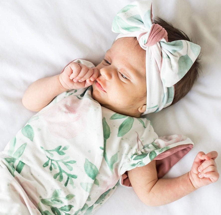Blushing Eucalyptus short-sleeve bodysuit for baby in Classic Brushed fabric styles with a botanical design.
