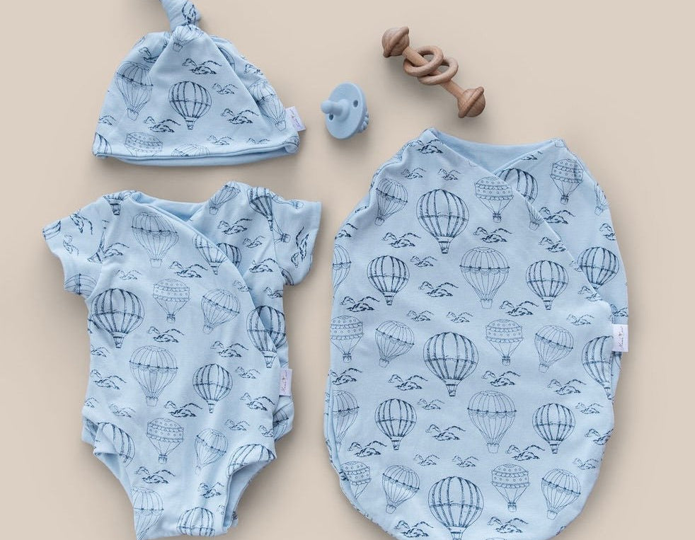 Newborn bundle with short sleeve essentials in bamboo cotton fabric with bon voyage design.