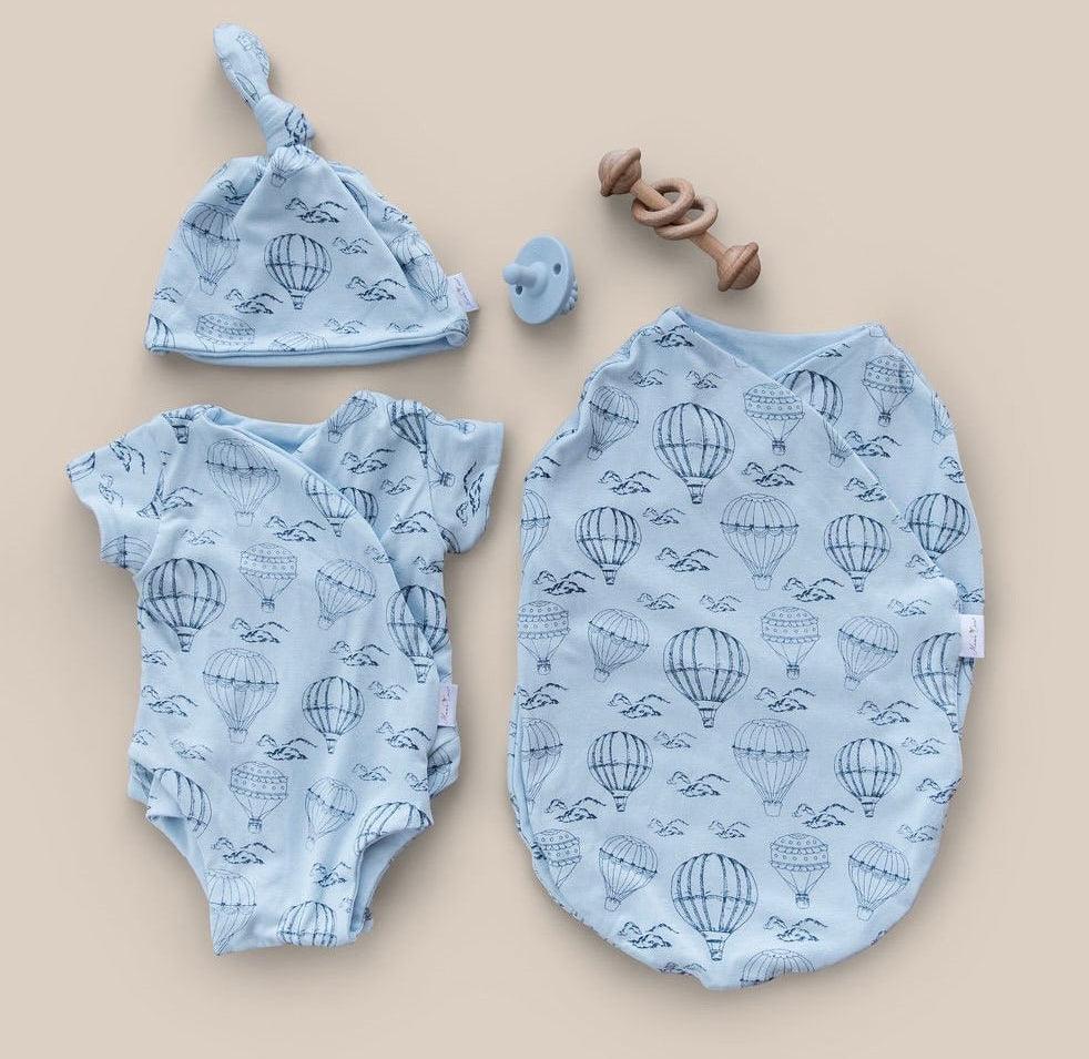 Newborn bundle with short sleeve essentials in bamboo cotton fabric with bon voyage design.