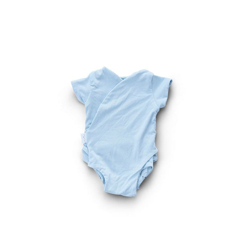Reversible winged bodysuit for babies in bon voyage design.