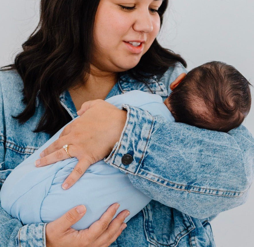 Premium baby cocoon swaddle crafted from Blue Swells Silky Modal fabric.