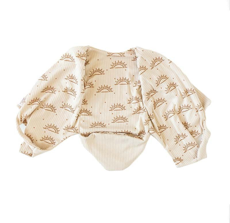 Sandy Sunsets design winged bodysuit for babies in classic brushed fabric.