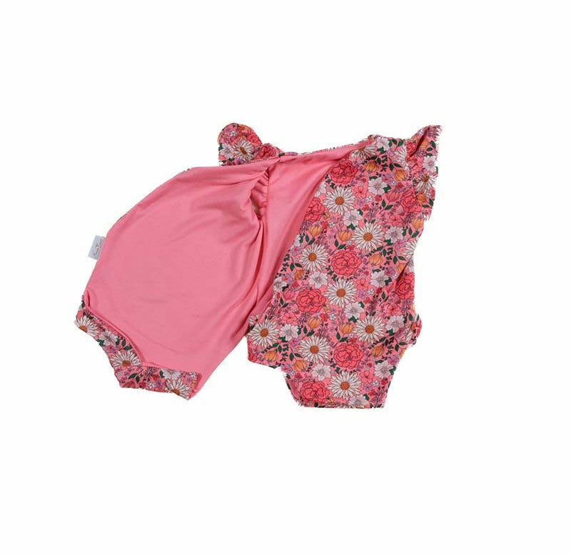 Reversible Flower Power floral baby bodysuit with comfortable short sleeves.