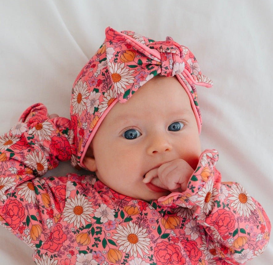 Adorable ruched beanie with bow for babies in Flower Power with a soft stretchy fit.