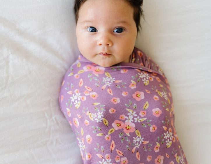 Classic brushed newborn essentials bundle, featuring a long sleeve top with ruffle cuffs in peachy lilac design.