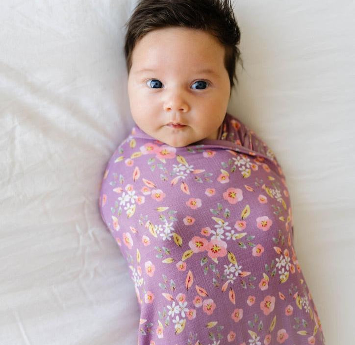 Classic brushed newborn essentials bundle, featuring a long sleeve top with ruffle cuffs in peachy lilac design.