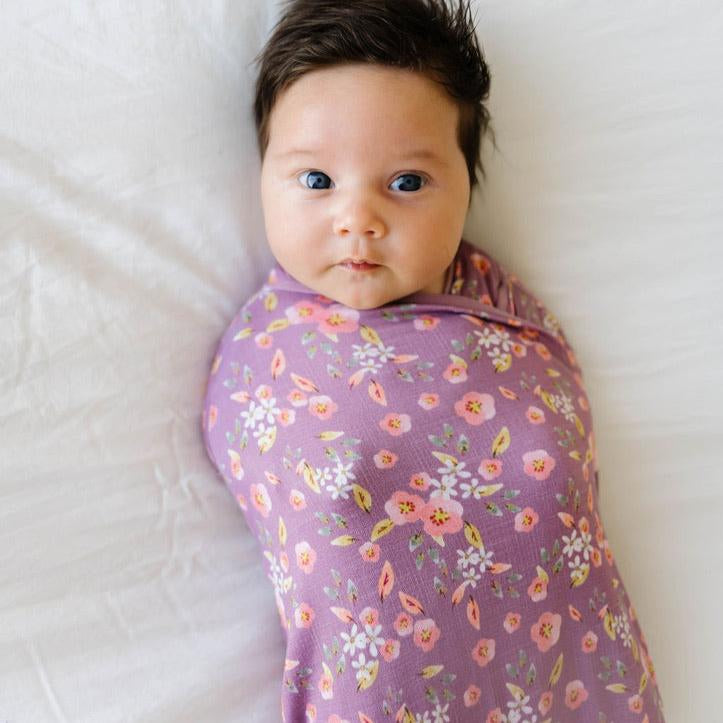 Classic brushed newborn essentials bundle, featuring a long sleeve top with ruffle cuffs in peachy lilac design.
