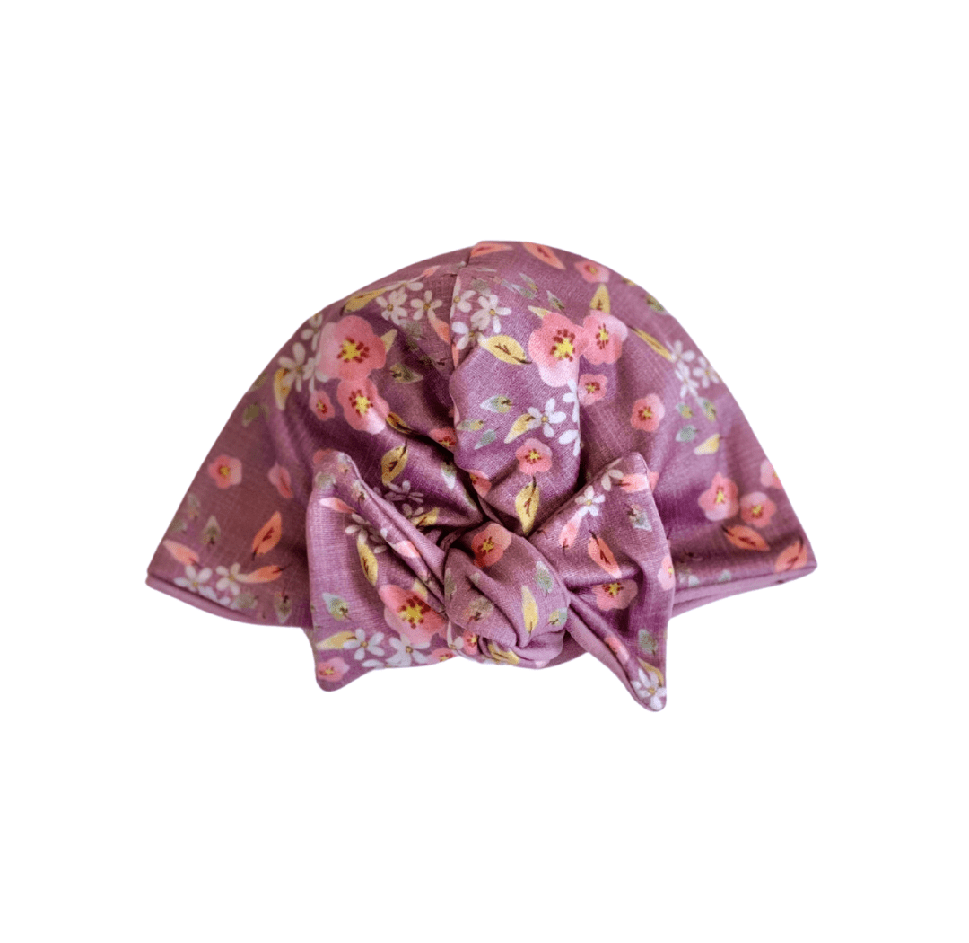 Adorable ruched beanie with bow for babies in Peachy Lilac with a soft stretchy fit.