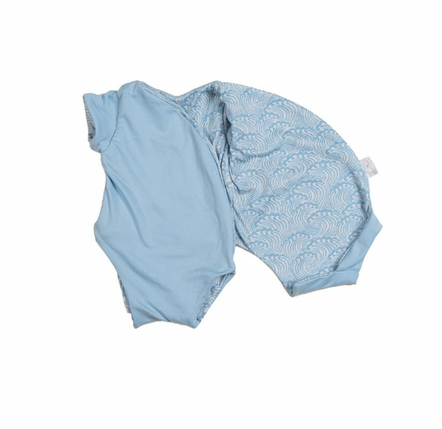 Soft reversible short-sleeve winged bodysuit in the Blue Swells design crafted from classic brushed fabric.