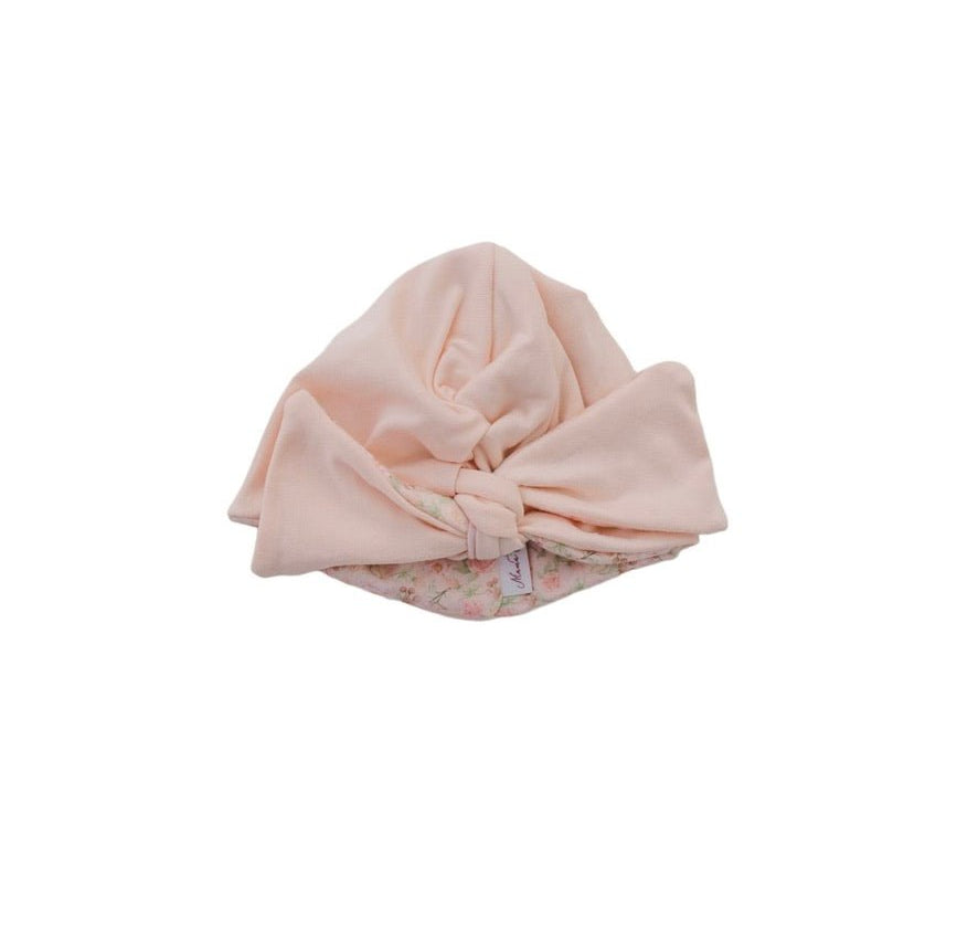 Reversible Classic brushed fabric makes this Dusty Roses ruched baby beanie with bow soft for everyday wear.