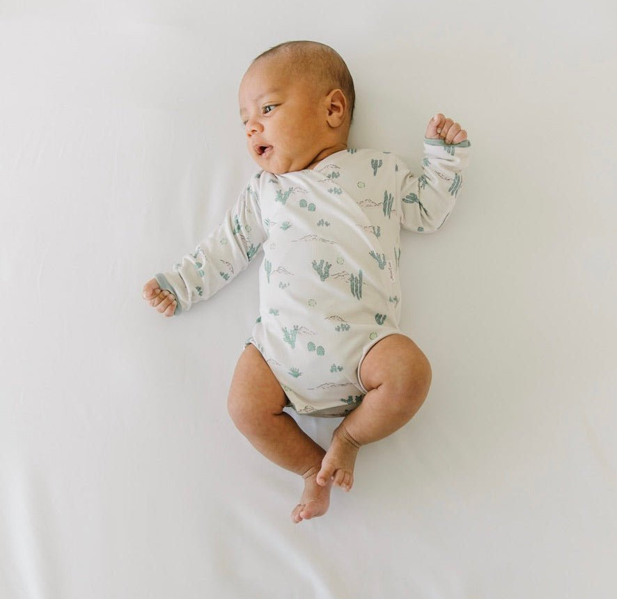 Desert Sunsets design winged bodysuit for babies in classic brushed fabric.
