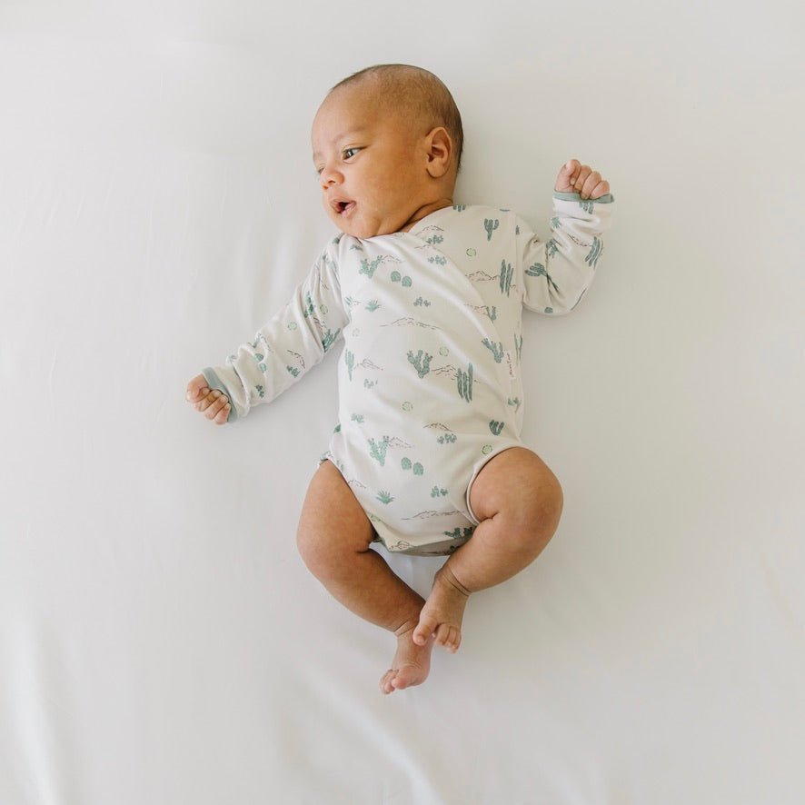 Desert Sunsets design winged bodysuit for babies in classic brushed fabric.