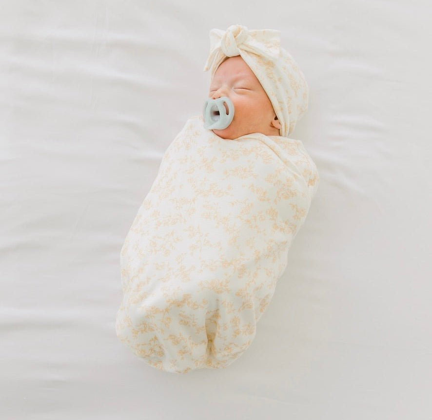 Cocoon swaddle baby blanket in Silky Modal fabric styles featuring the Bitty Blooms pattern.